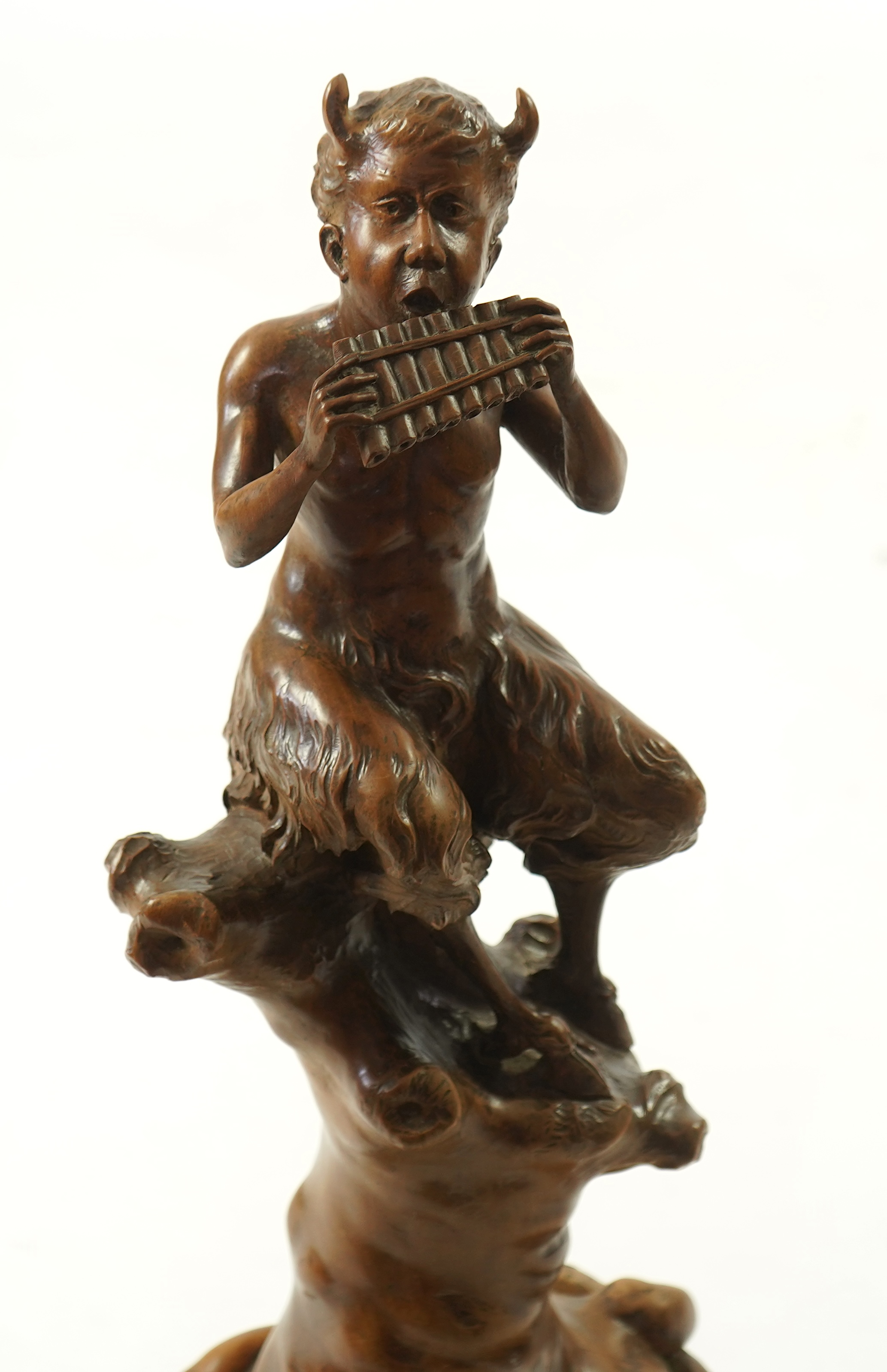 A late 19th century French carved walnut figure of Pan
